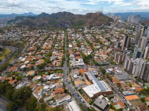 Stunning aerial photograph showcasing the diverse landscape of Belo Horizonte, with urban buildings and mountains.