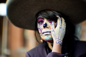 Vibrant portrait of a woman dressed as Catrina for Dia de los Muertos in Mexico City.
