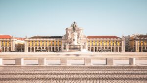 Wide view of Praça do Comércio with iconic architecture in Lisbon, Portugal.